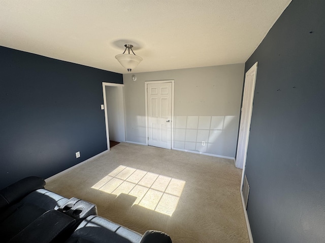 unfurnished bedroom with visible vents, carpet, baseboards, and a closet