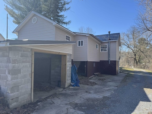 exterior space with metal roof