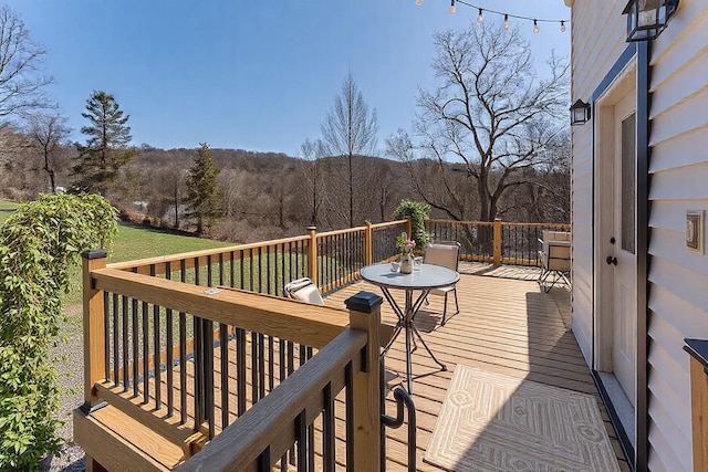 wooden deck featuring a wooded view