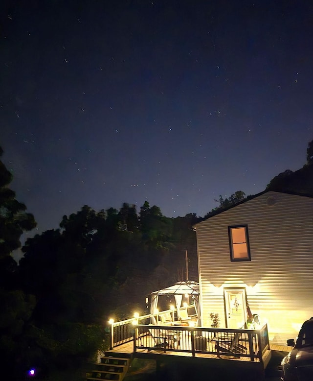 exterior space featuring a wooden deck