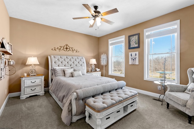 bedroom with baseboards, carpet floors, visible vents, and a ceiling fan