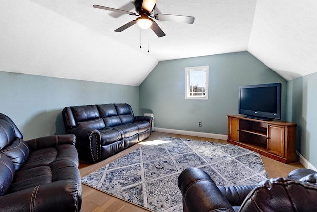 living area featuring light wood-style flooring, baseboards, lofted ceiling, and a ceiling fan