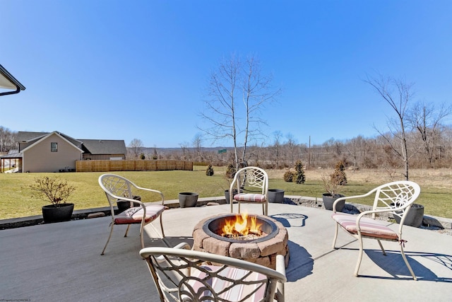 view of patio / terrace featuring fence and an outdoor fire pit