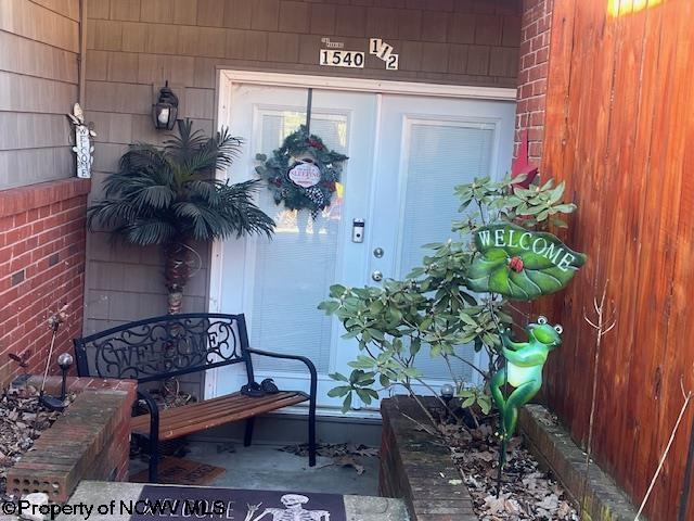 property entrance with brick siding