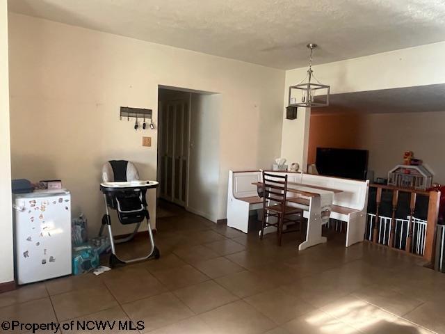 15401/2 Country Club Rd, Fairmont, WV 26554 - dining room with tile patterned flooring and a chandelier