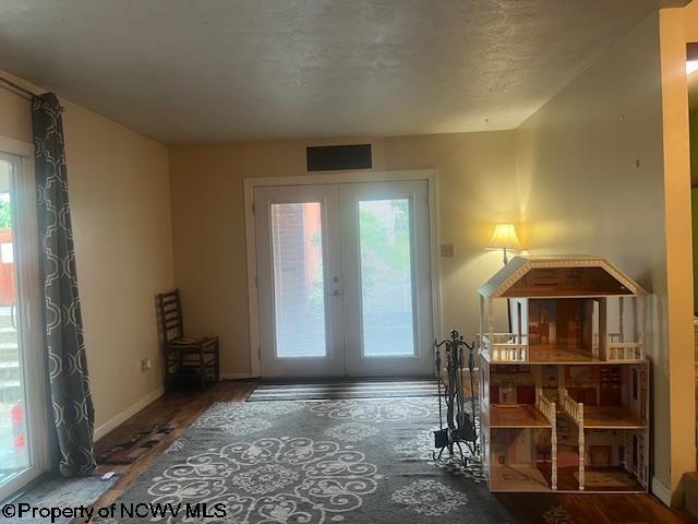 15401/2 Country Club Rd, Fairmont, WV 26554 - entryway featuring french doors, wood finished floors, and baseboards