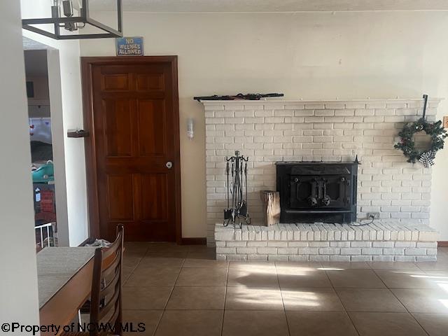 15401/2 Country Club Rd, Fairmont, WV 26554 - living area featuring tile patterned floors, a brick fireplace, and baseboards