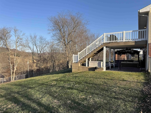 view of yard with a patio area, stairs, and a deck