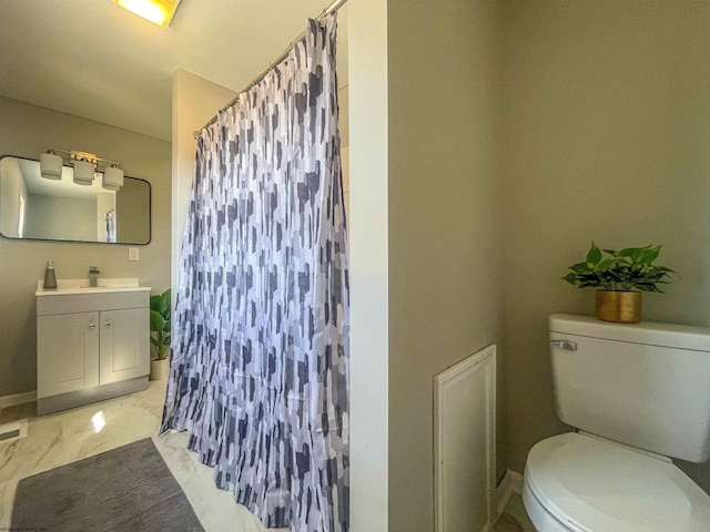 full bathroom with a shower with curtain, toilet, and marble finish floor