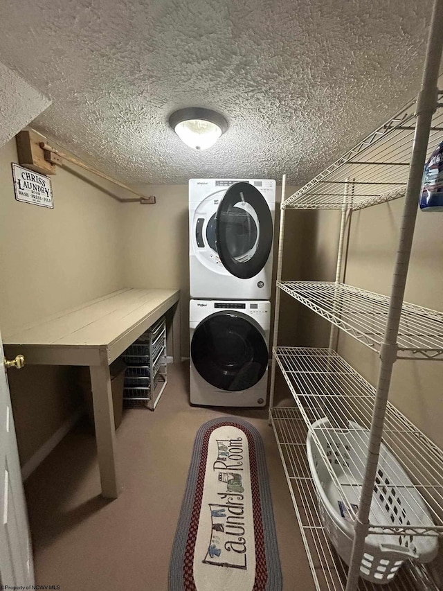 washroom with a textured ceiling, stacked washer and clothes dryer, laundry area, and carpet