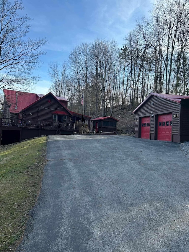 view of road with aphalt driveway