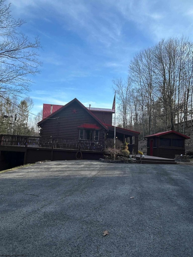 view of side of home with a deck