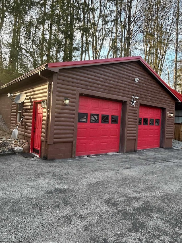 garage featuring driveway