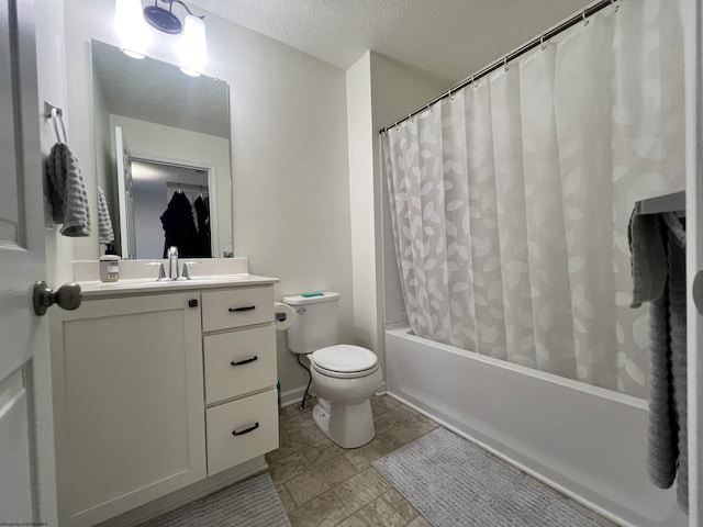 full bathroom with baseboards, toilet, vanity, shower / tub combo with curtain, and a textured ceiling