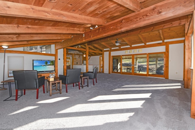 carpeted dining space with a ceiling fan, lofted ceiling with beams, and wood ceiling