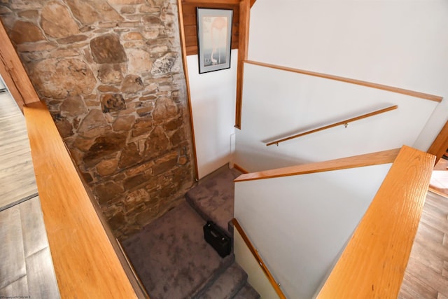 stairway featuring wood finished floors