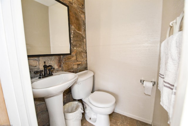 bathroom featuring toilet