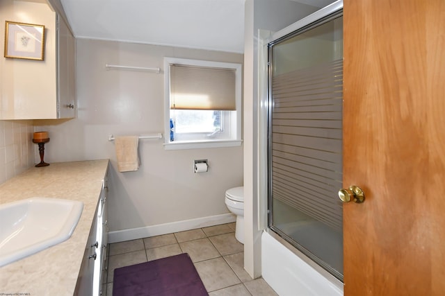 full bathroom with toilet, backsplash, tile patterned flooring, baseboards, and vanity