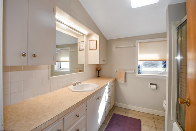 full bath with an enclosed shower, backsplash, tile patterned flooring, vanity, and vaulted ceiling