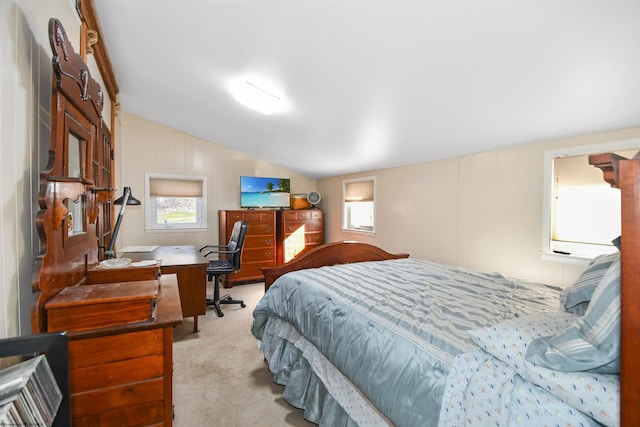 bedroom featuring vaulted ceiling and carpet