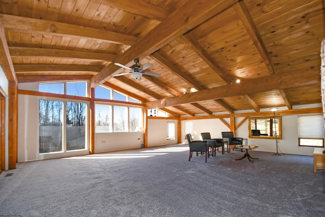 unfurnished room featuring lofted ceiling with beams, plenty of natural light, wood ceiling, and carpet floors