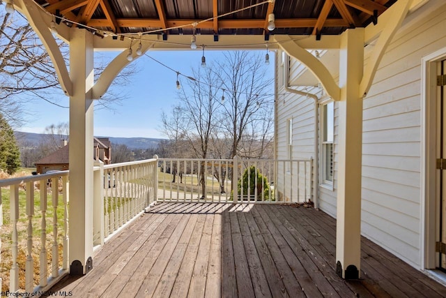 wooden terrace with a mountain view