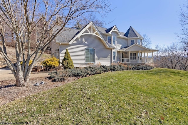 view of front of house featuring a porch and a front yard