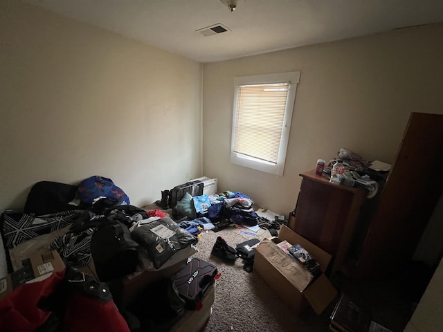 bedroom with visible vents and carpet floors