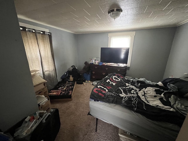 bedroom featuring carpet flooring and crown molding