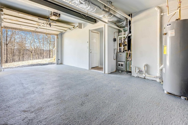 garage featuring electric water heater and a garage door opener