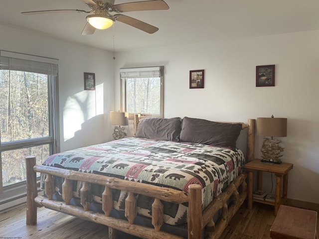 bedroom featuring wood finished floors and a ceiling fan