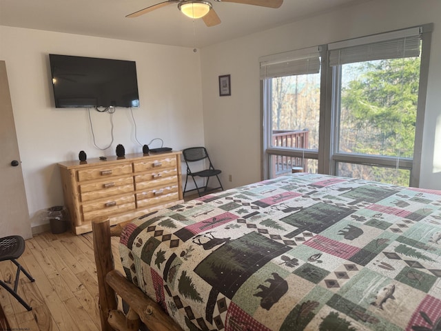 bedroom with a ceiling fan and hardwood / wood-style flooring