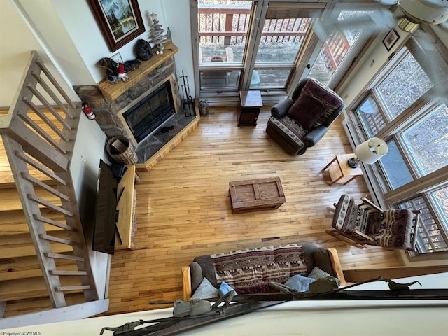 living room with wood finished floors and a fireplace