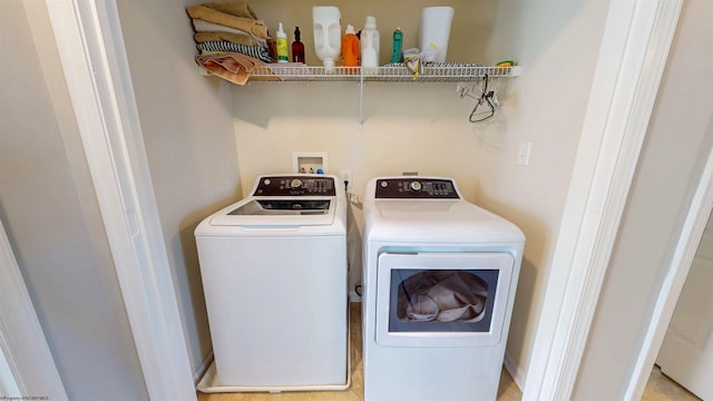 laundry area with laundry area and separate washer and dryer