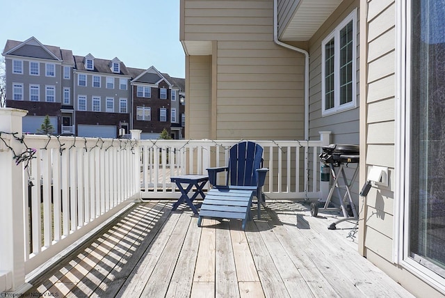 wooden terrace featuring a residential view