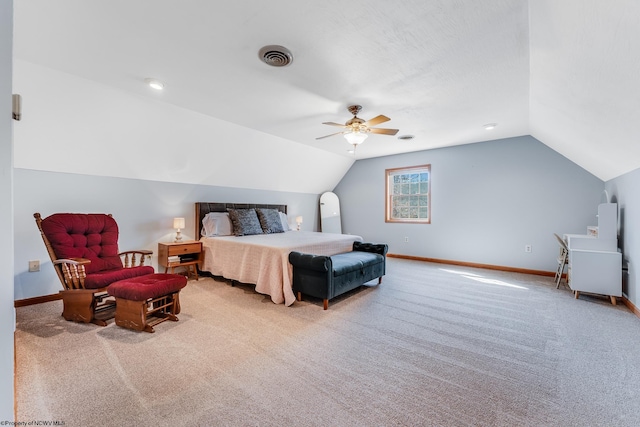 bedroom with vaulted ceiling, baseboards, visible vents, and light carpet