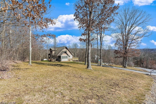 view of yard with a wooded view