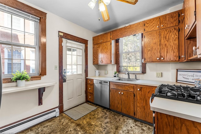 kitchen with plenty of natural light, a sink, light countertops, dishwasher, and a baseboard heating unit