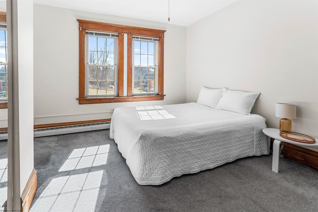 carpeted bedroom featuring a baseboard radiator