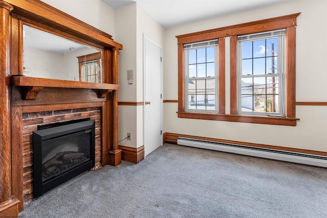 carpeted living area featuring a baseboard heating unit, a glass covered fireplace, and baseboards