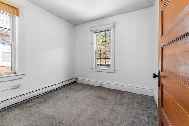 spare room featuring baseboards, baseboard heating, and carpet