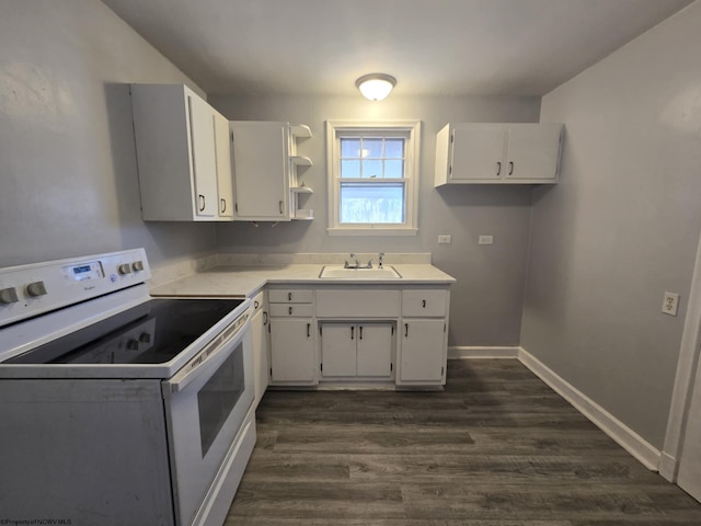 kitchen featuring white range with electric cooktop, a sink, dark wood-style floors, white cabinets, and light countertops