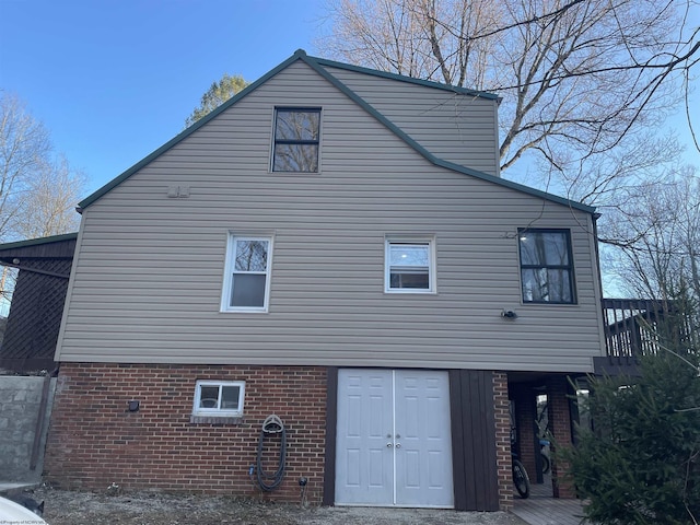 view of property exterior featuring brick siding