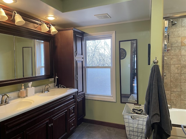 full bathroom with double vanity, visible vents, baseboards, and a sink