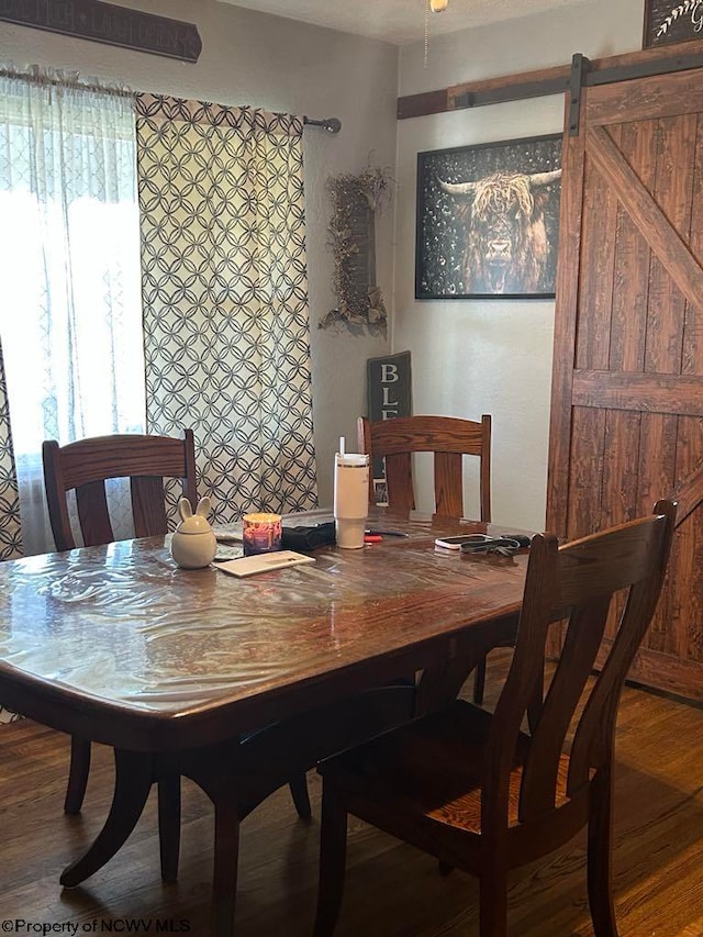 dining space featuring wood finished floors