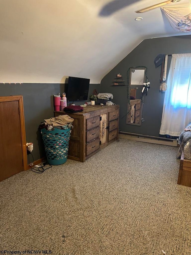 carpeted bedroom with lofted ceiling