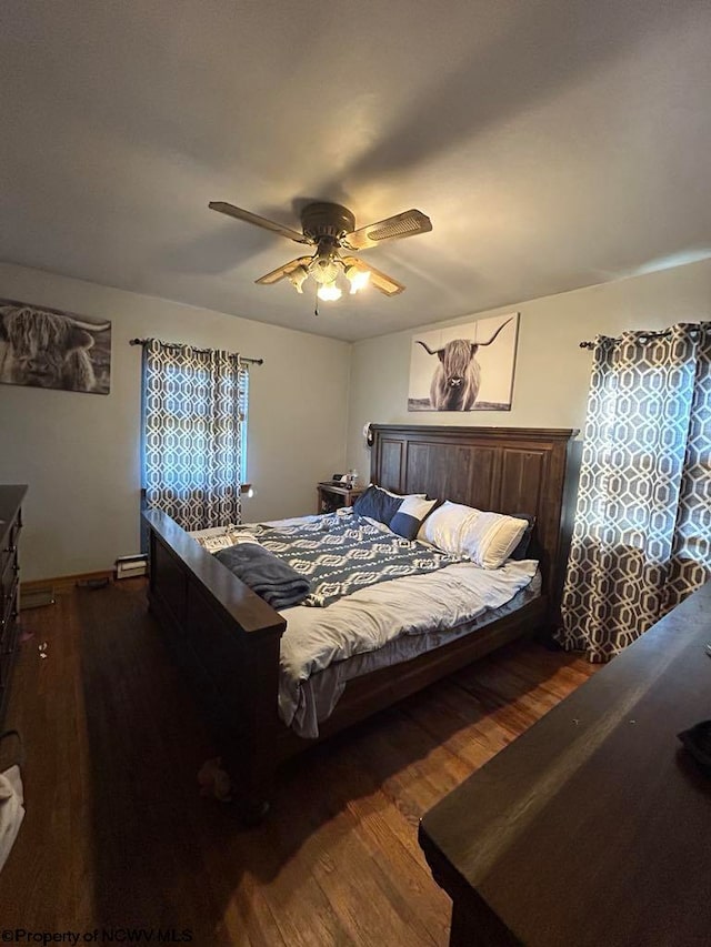 bedroom with wood finished floors and ceiling fan