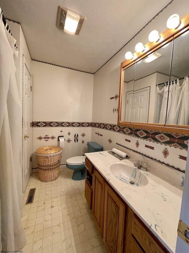 294 Landmark Ests, Jane Lew, WV 26378 - bathroom with visible vents, toilet, vanity, tile patterned floors, and a textured ceiling