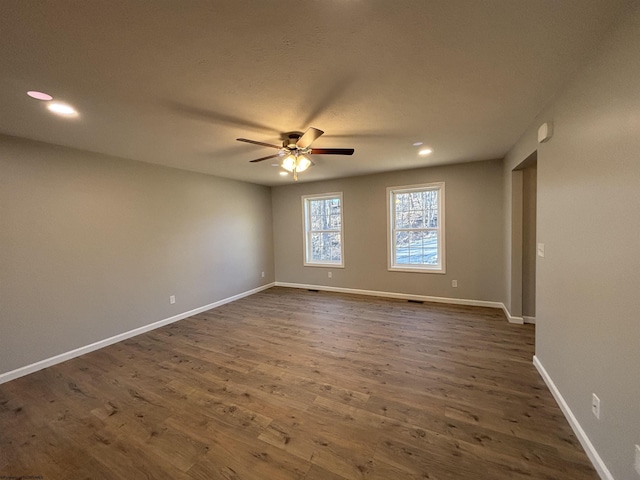 unfurnished room featuring recessed lighting, baseboards, ceiling fan, and dark wood-style flooring