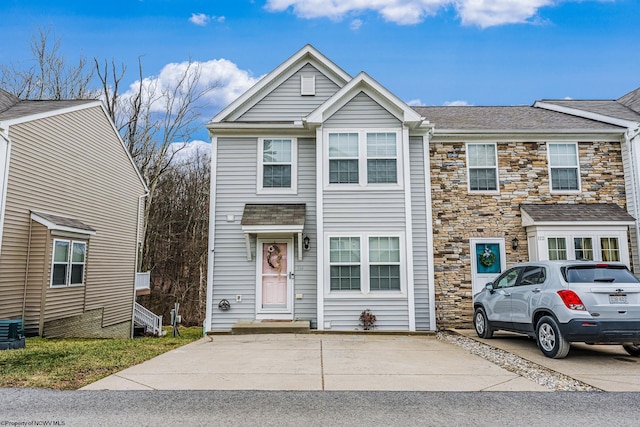 view of property featuring stone siding